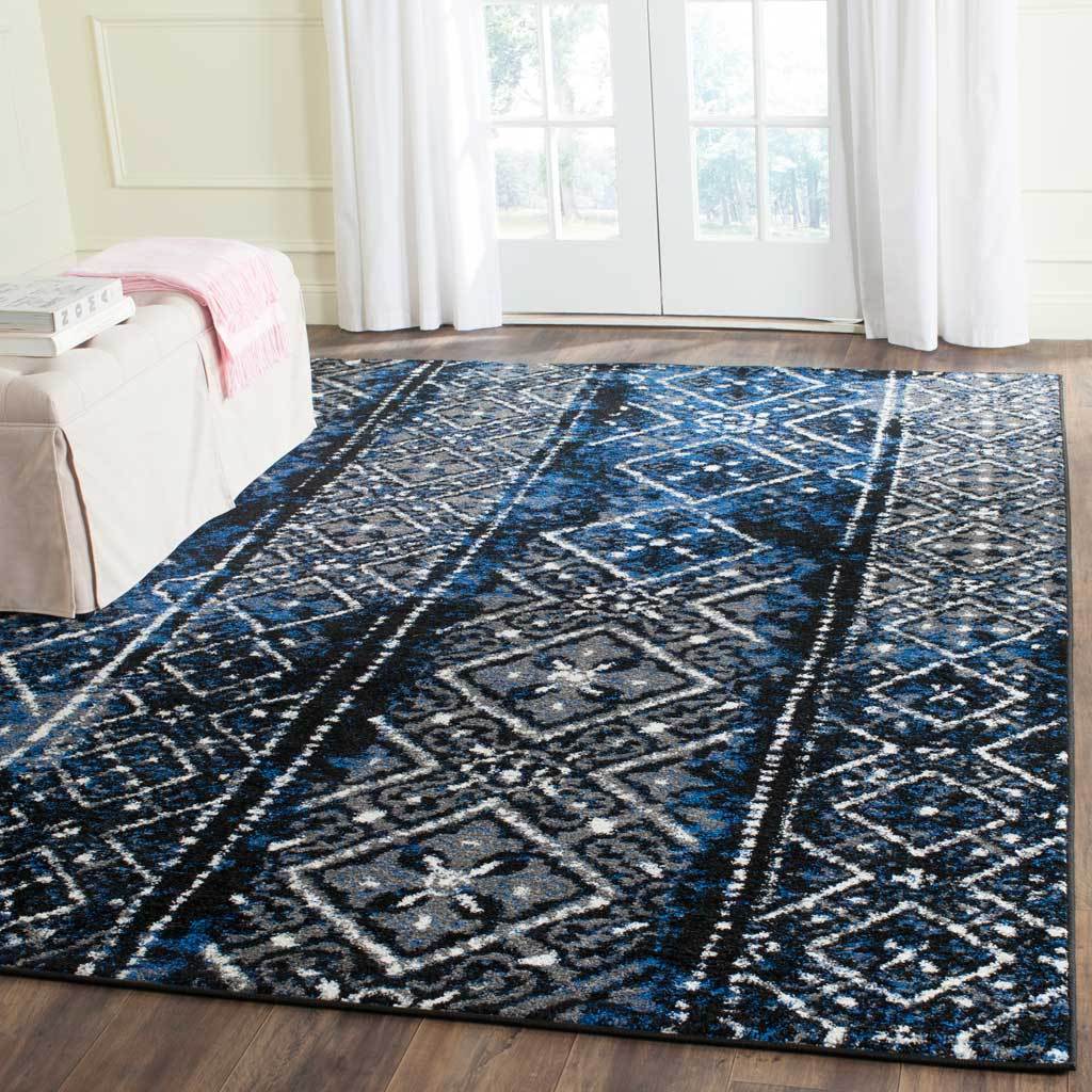 Cobalt blue and black bands of diamonds give this spacious rug bold contrast