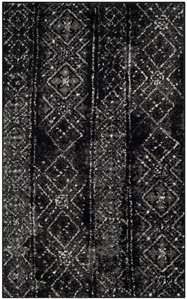 Compact black and silver rug brings a mottled finish to rows of traditional diamonds