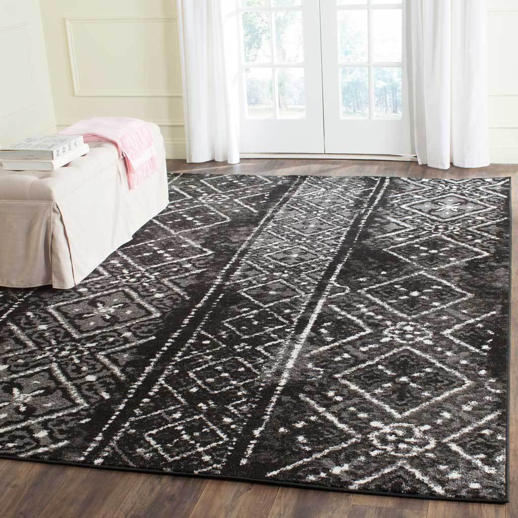 Black and silver diamond bands create a striking foundation for a bright living space