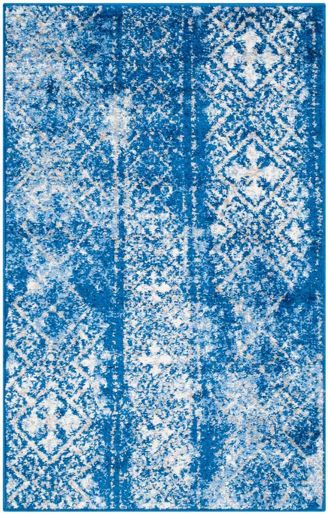 Blue and silver accent rug layers delicate diamonds over a softly distressed field