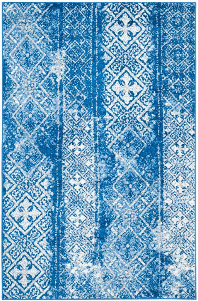 Vivid blue and silver diamonds bring lively contrast to a distressed rectangular rug