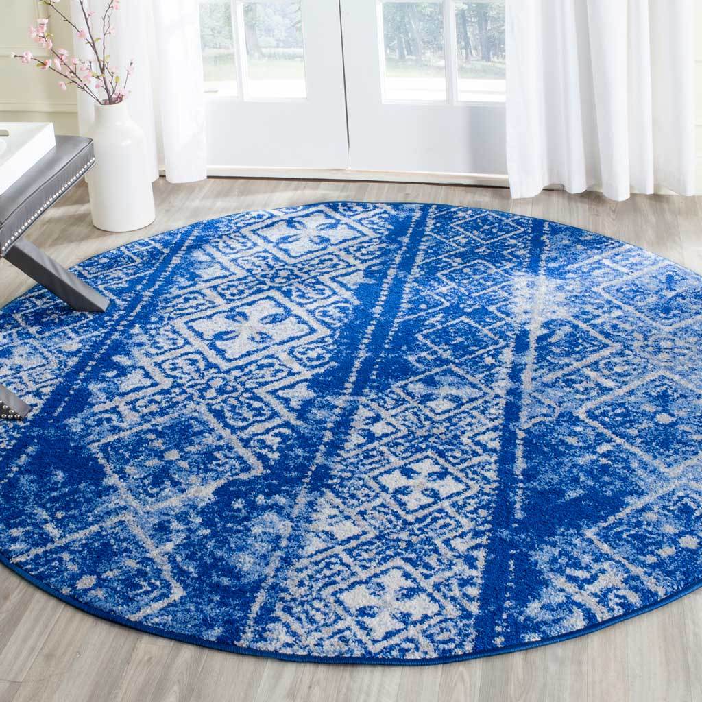 This blue and silver round rug brings vibrant color and a softly weathered pattern underfoot.