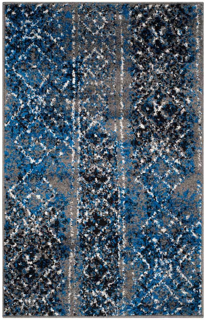 Silver and blue accent rug adds dark diamonds to a weathered geometric field