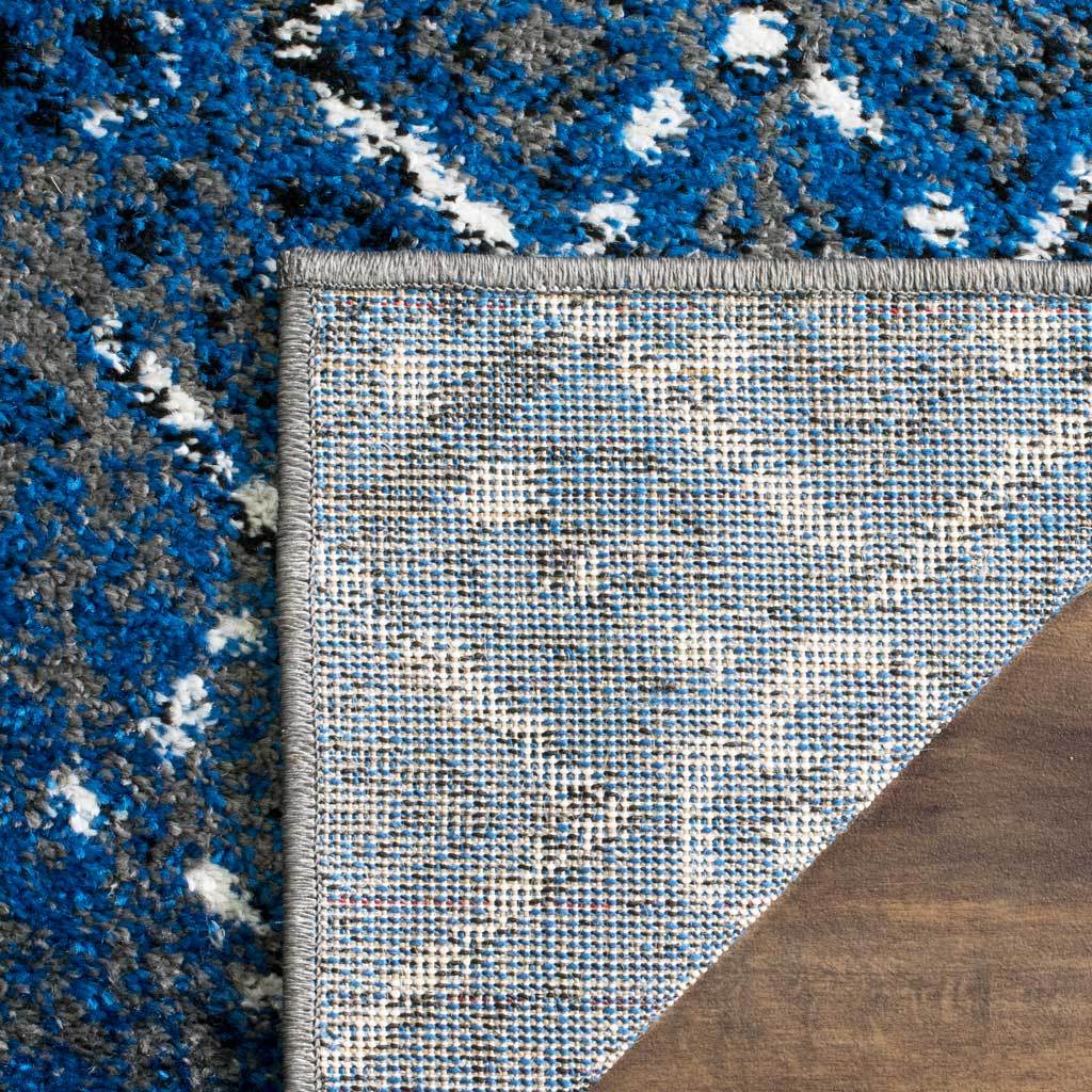 Tightly woven backing and gray binding add a practical finish beneath vivid blue pile