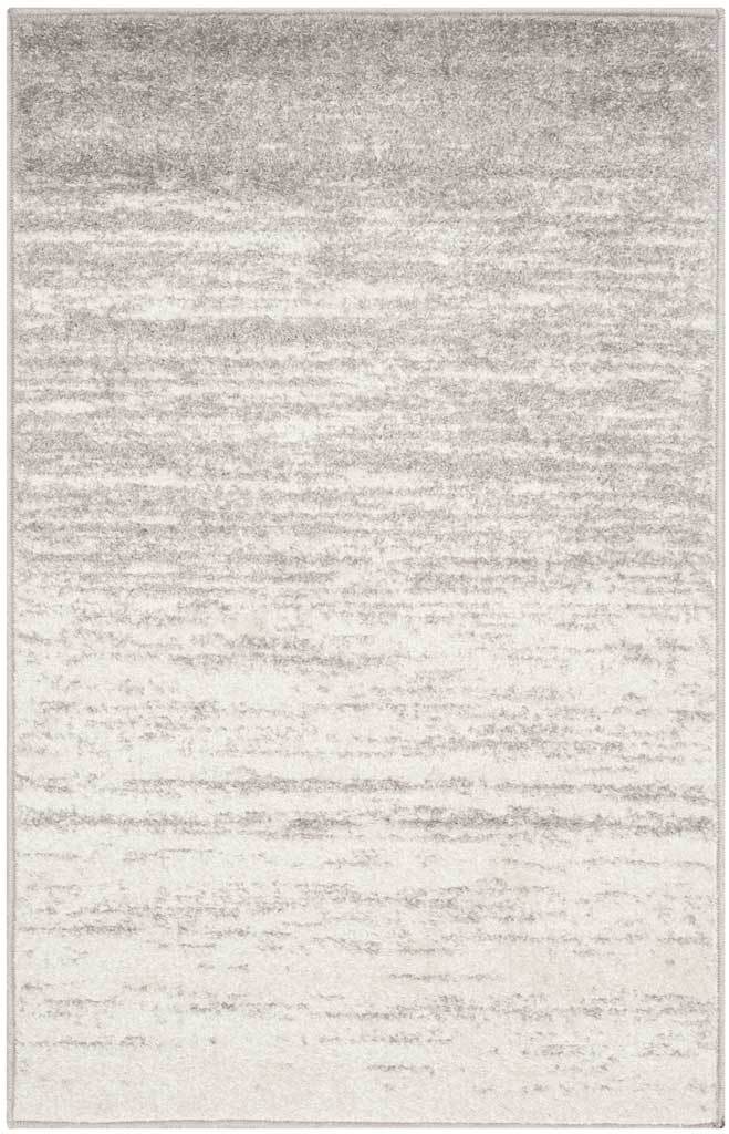 This compact ivory rug blends soft silver shading with lightly distressed horizontal lines.
