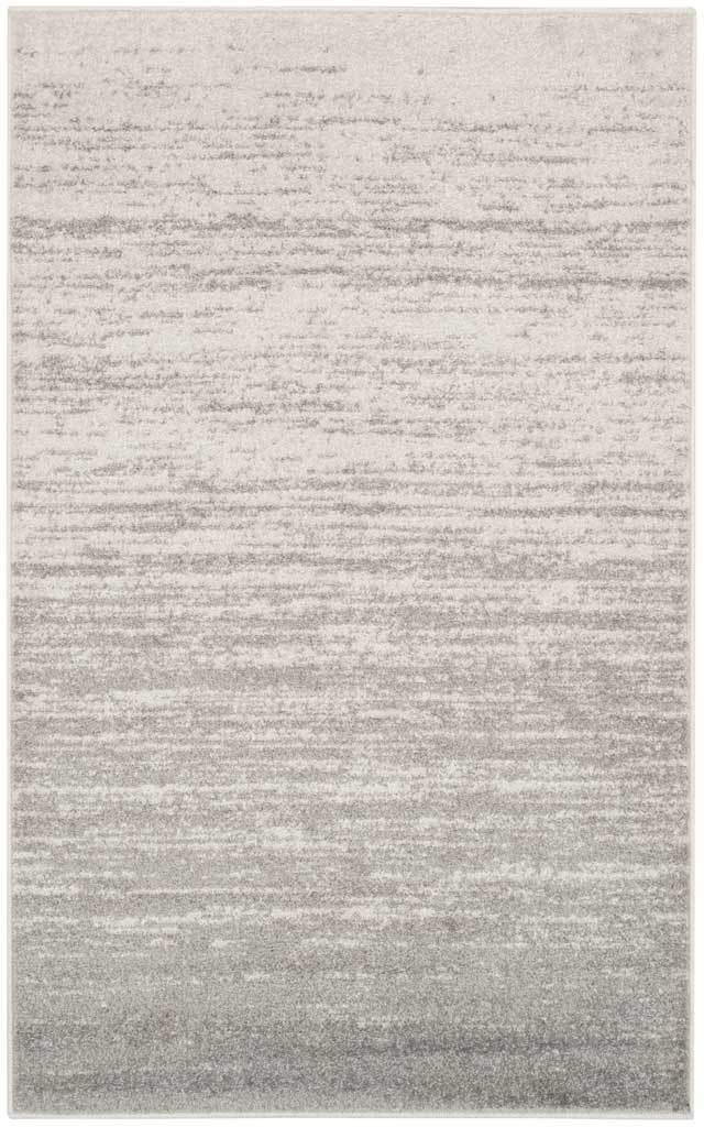 Ivory gives way to silvery gray in an understated, weathered linear pattern.
