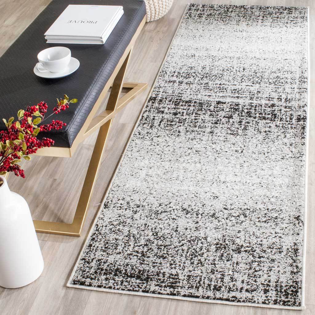Silver and black distressed pattern lends subtle contrast and depth to a slim runner
