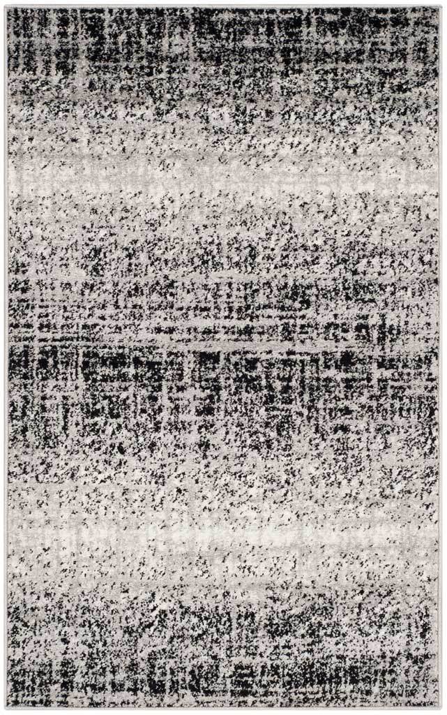 Silver and black rug with a mottled crosshatch pattern and wide, softly faded bands