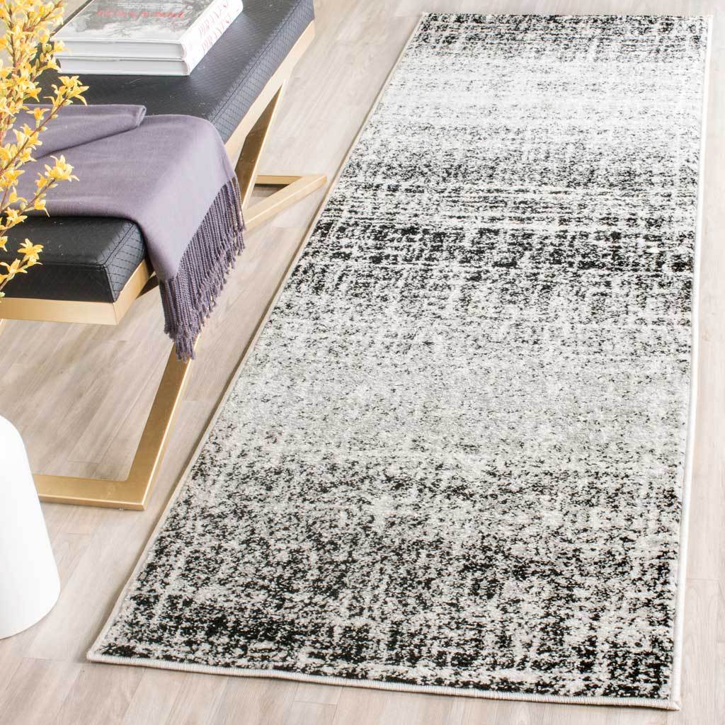 High-contrast ivory and black pattern brings a graphic touch to narrow spaces
