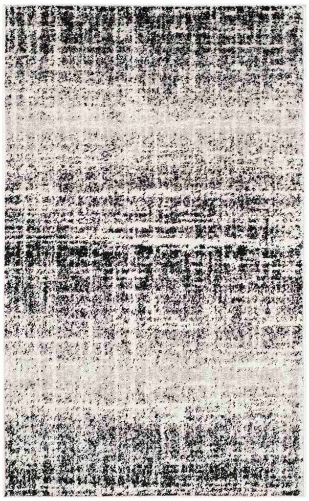 Ivory and black rug with softly faded stripes and dense, weathered crosshatching