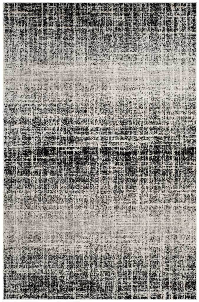 Ivory and black rectangular rug with broken linear strokes and alternating light and dark bands