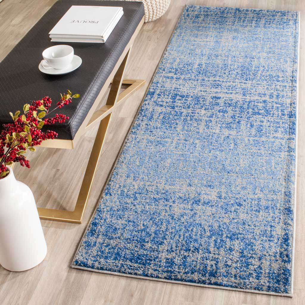 Soft blue tones and a weathered abstract motif bring a fresh accent to narrow spaces