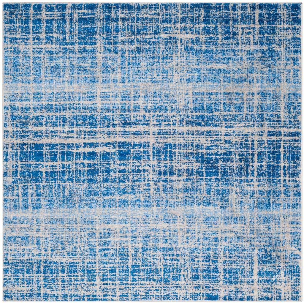 Square blue and silver rug with dense broken lines and softly faded horizontal bands