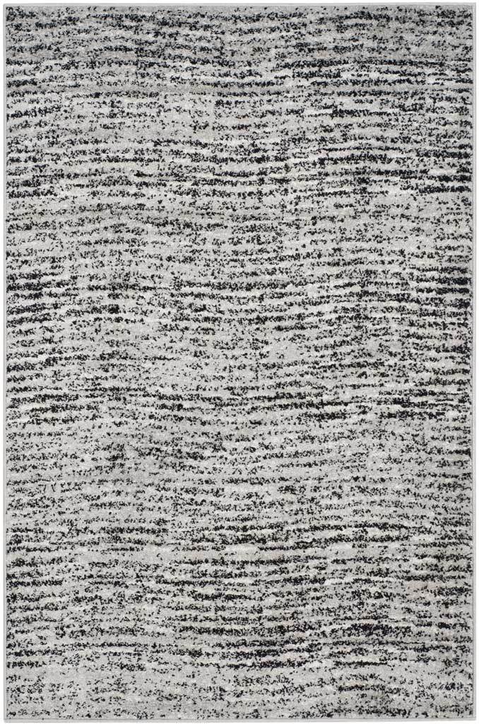 4' x 6' black and silver rug with a textured mix of fragmented, linear markings