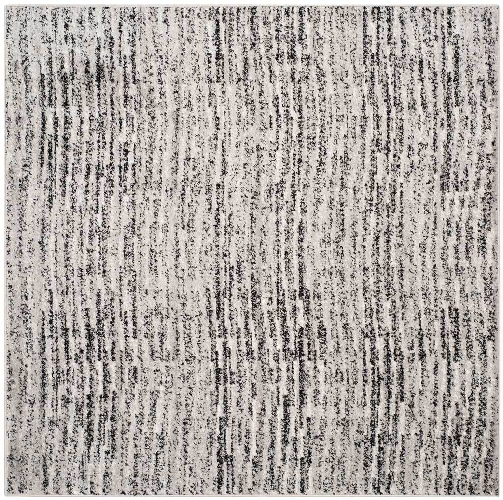 Square black and silver rug with dense, weathered streaks for a graphic modern foundation