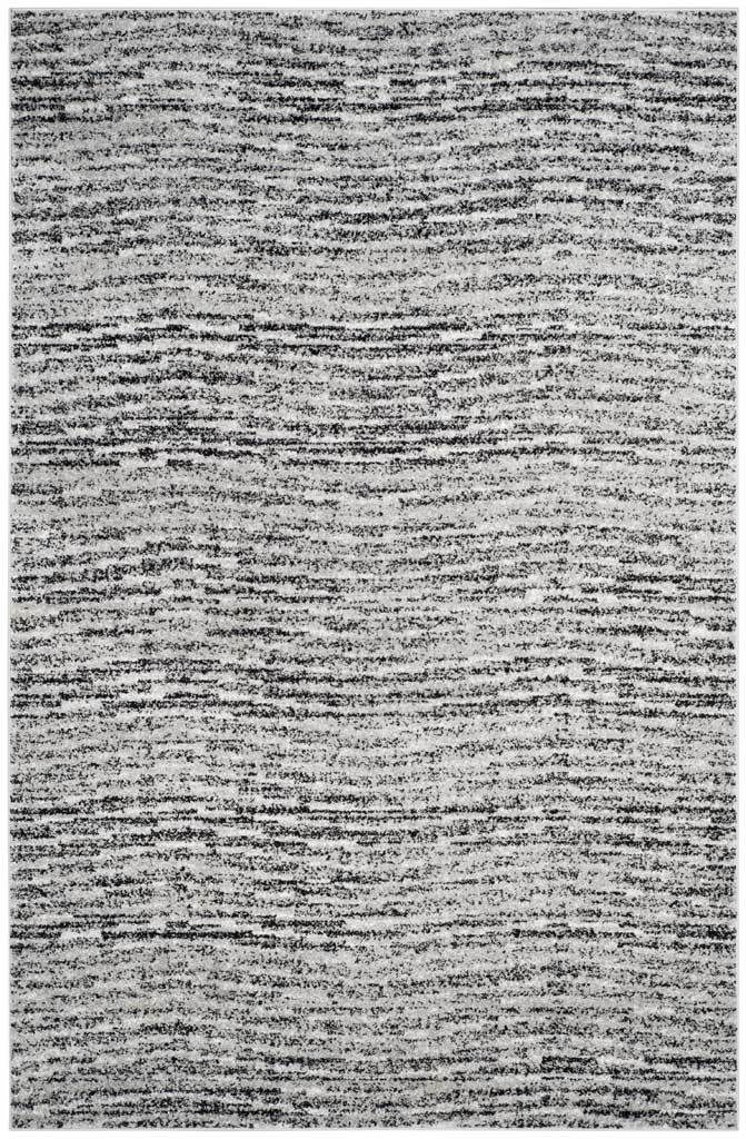 6' x 9' black and silver rug with finely layered, irregular stripes across its rectangular field
