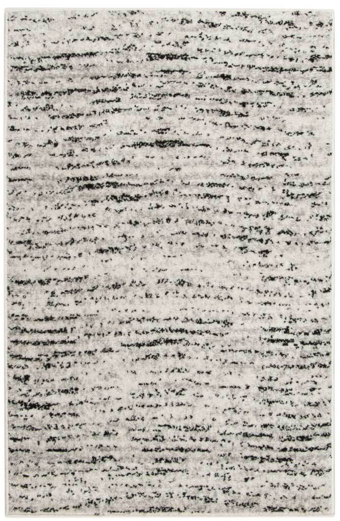 Small ivory and silver accent rug with uneven linear marks for understated contrast