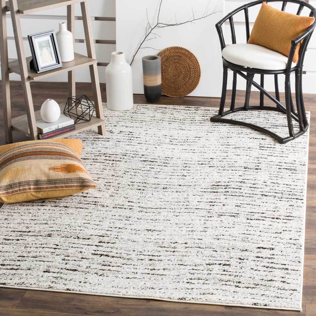 Ivory and silver distressed stripes brighten a casual living space with subtle contrast