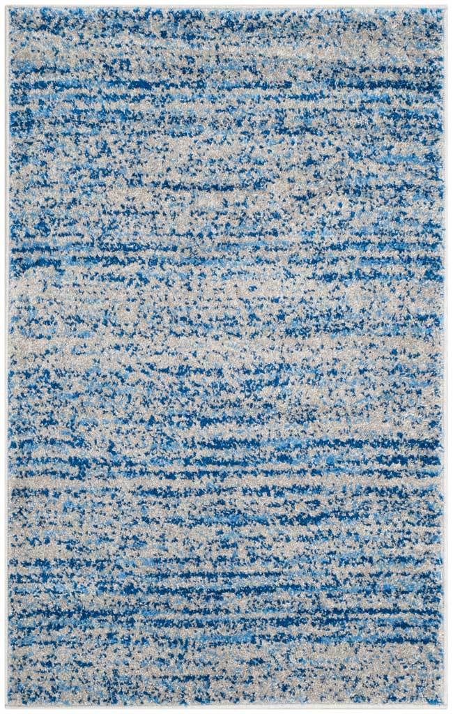 Small blue and silver accent rug with varied linear markings and a softly speckled surface