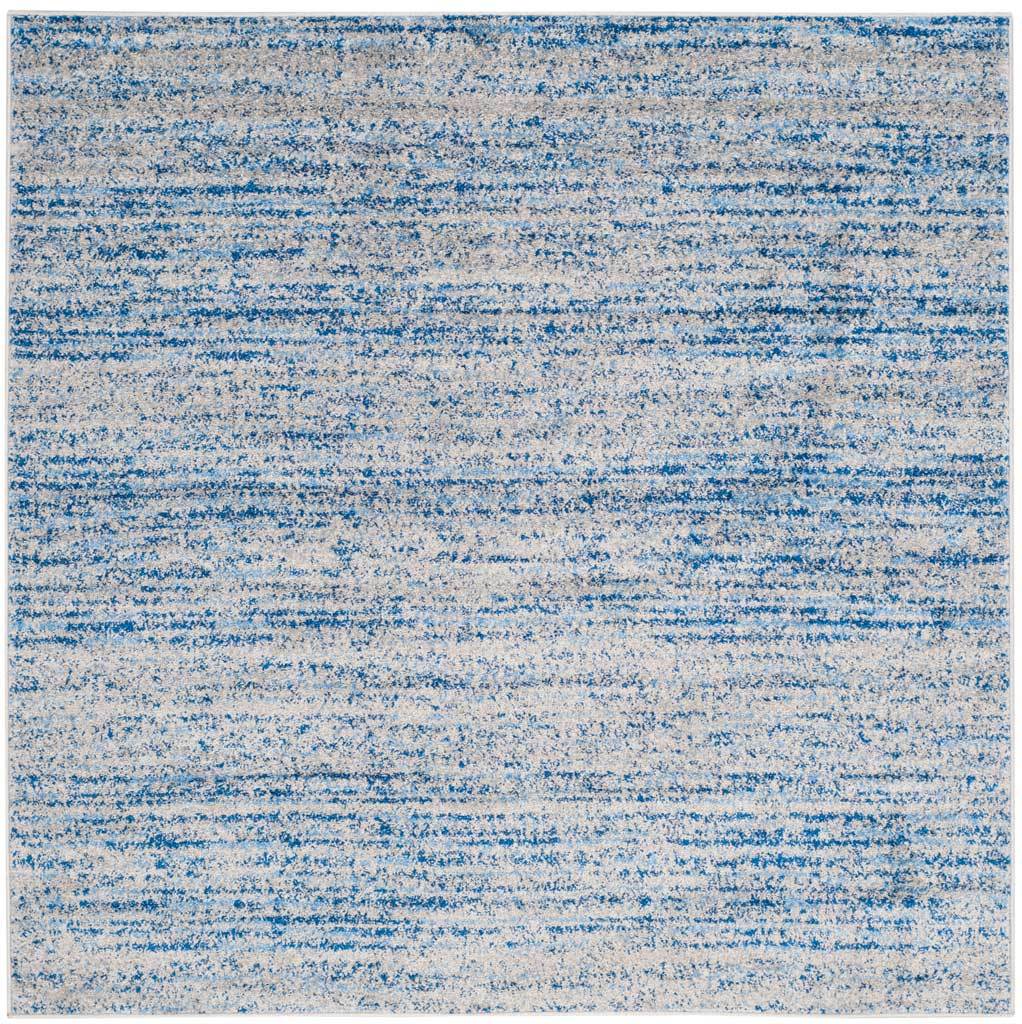 Square blue and silver rug with irregular bands that create a calm, painterly texture