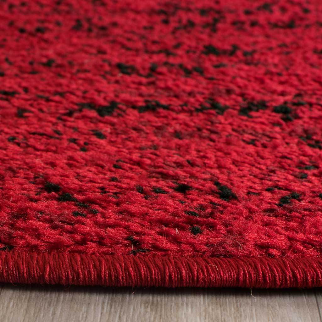 Rich red pile with black flecks is finished with a tightly bound edge