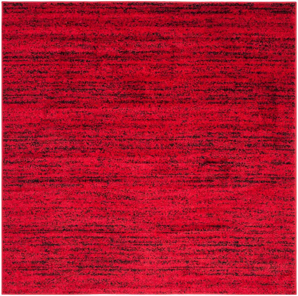 Square red and black rug with dense, irregular streaks for a bold modern statement
