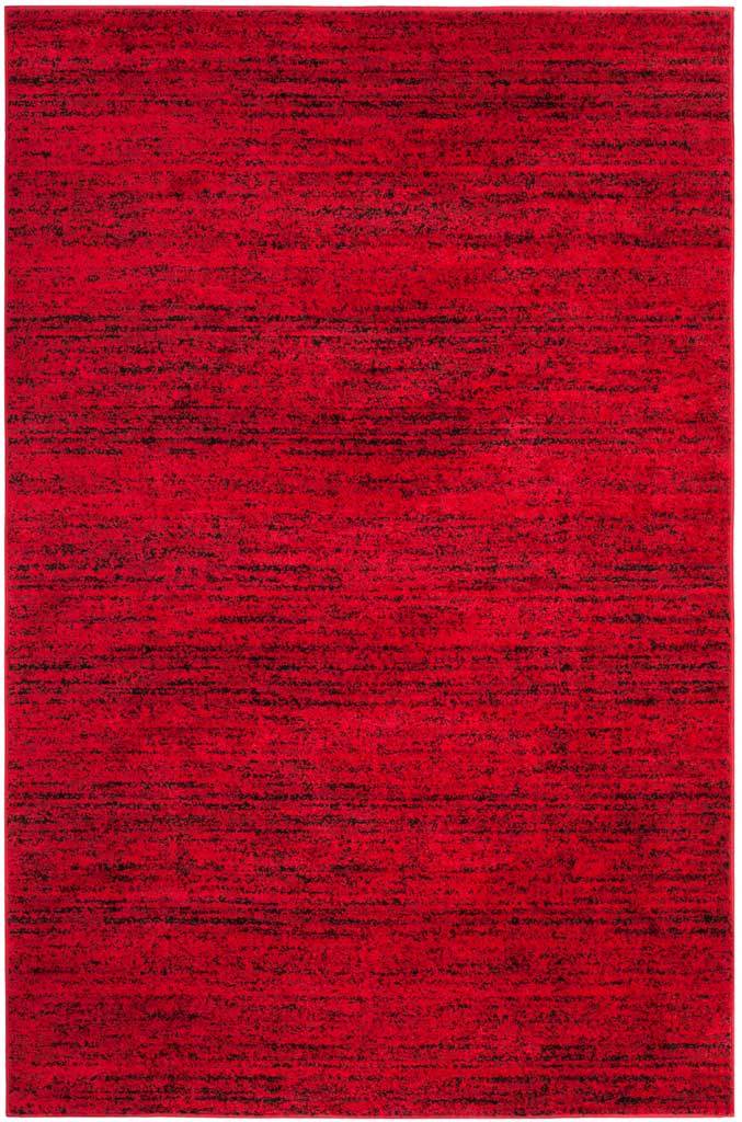 6' x 9' red and black rug with layered, distressed lines and rich color variation