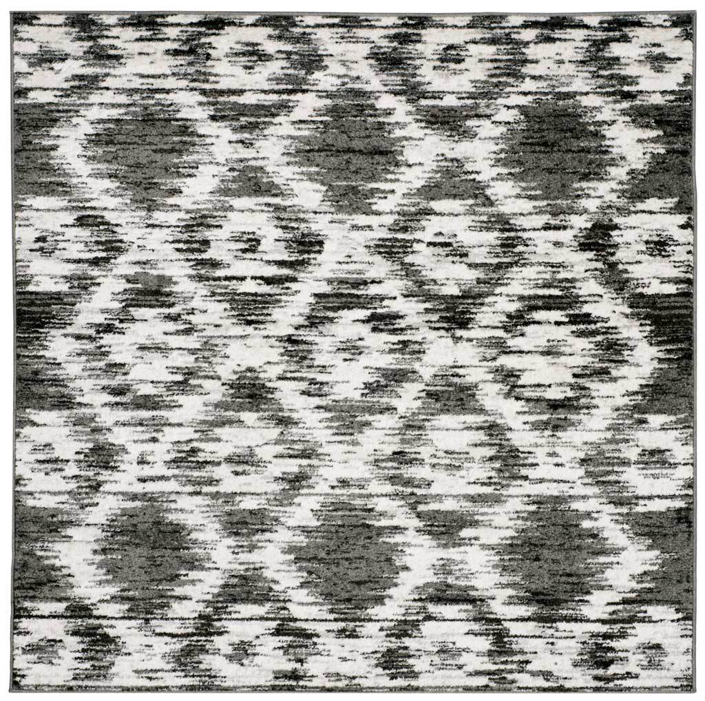 Square rug pairs charcoal diamond motifs with an ivory ground and weathered texture