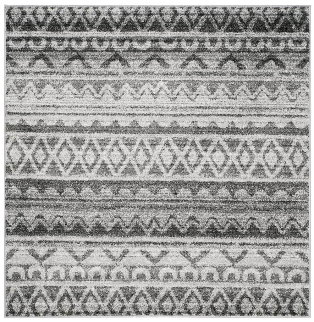 A square ivory rug comes alive with charcoal diamonds, zigzags and textured stripes.
