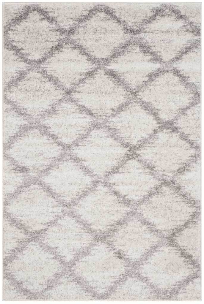 Silver trellis lines form layered diamonds across this ivory rectangular rug