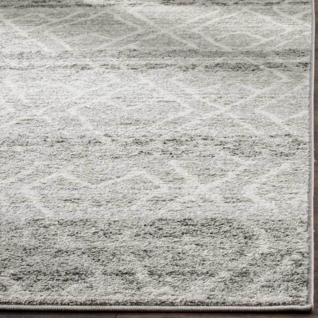 Neatly finished edges complement a textured pile with pale geometric lines