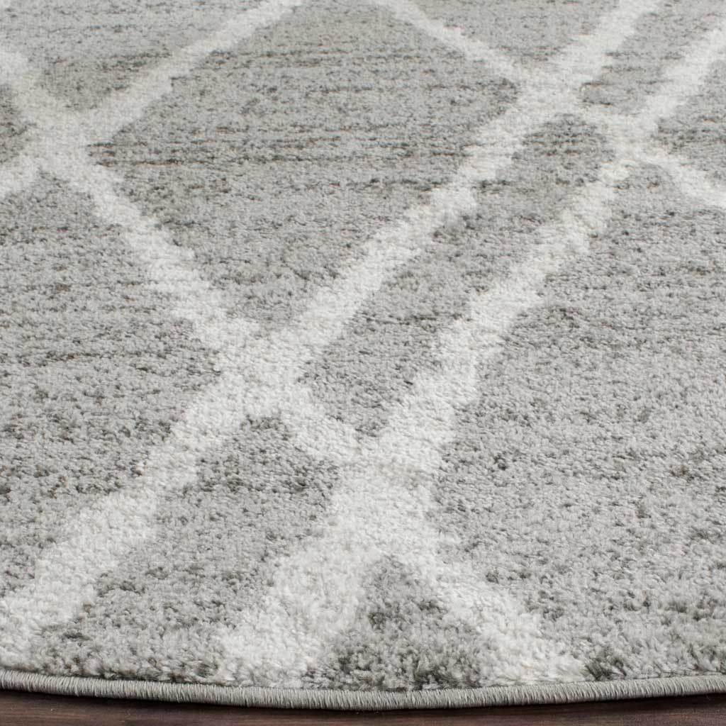 Textured ivory and silver pile meets a neatly bound edge for a polished finish