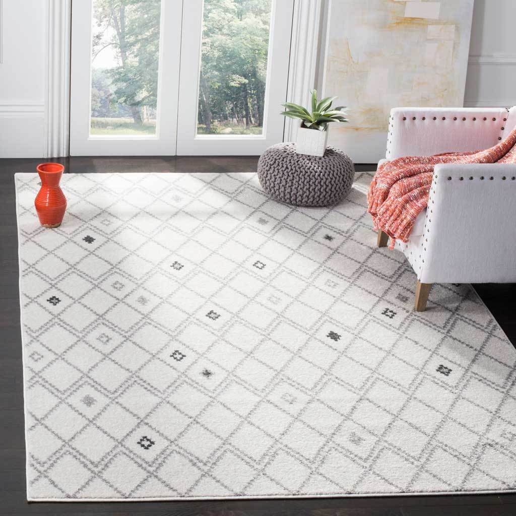 Ivory and gray diamond motifs bring understated pattern to a bright living space.