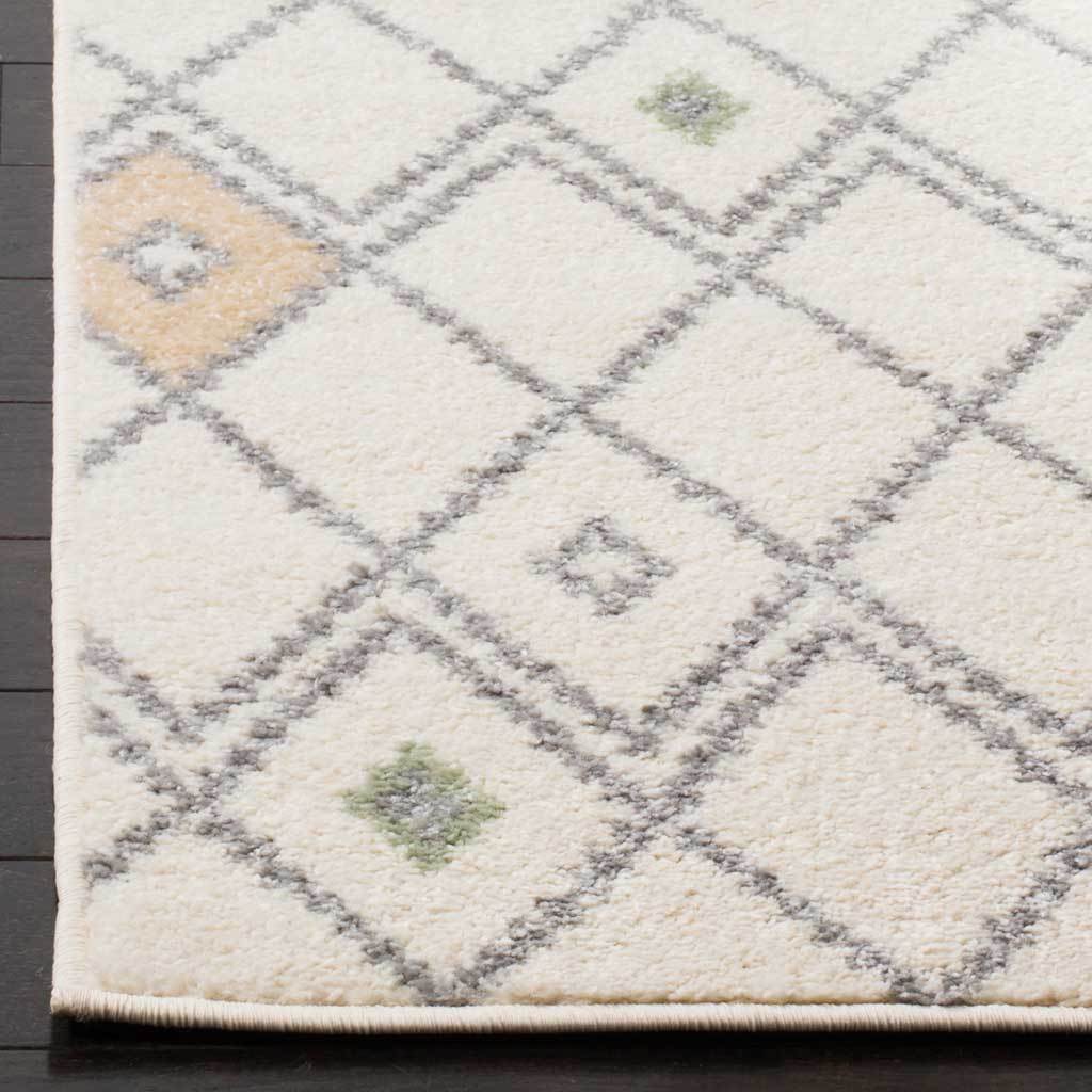 A bound corner reveals soft ivory pile, gray diamond lines, and touches of yellow and green.