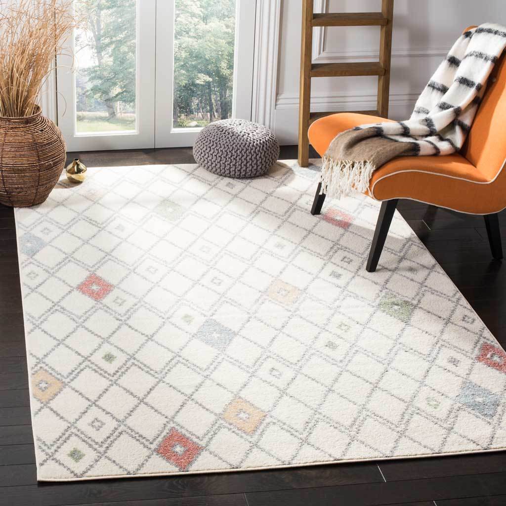 Colorful diamond accents enliven the soft ivory trellis rug in a welcoming living space.