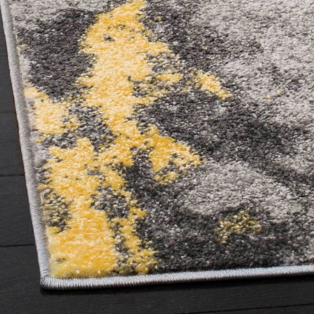 Soft gray and yellow pile meets neatly bound edges for a polished finish.