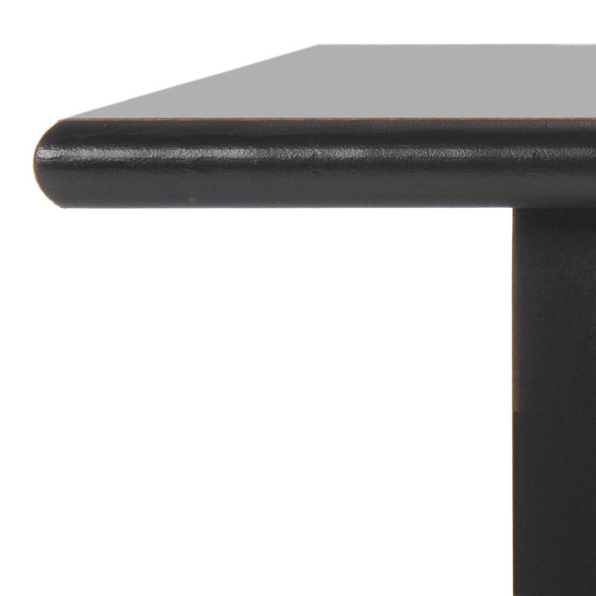 A softly rounded tabletop edge adds a refined touch to the distressed black finish