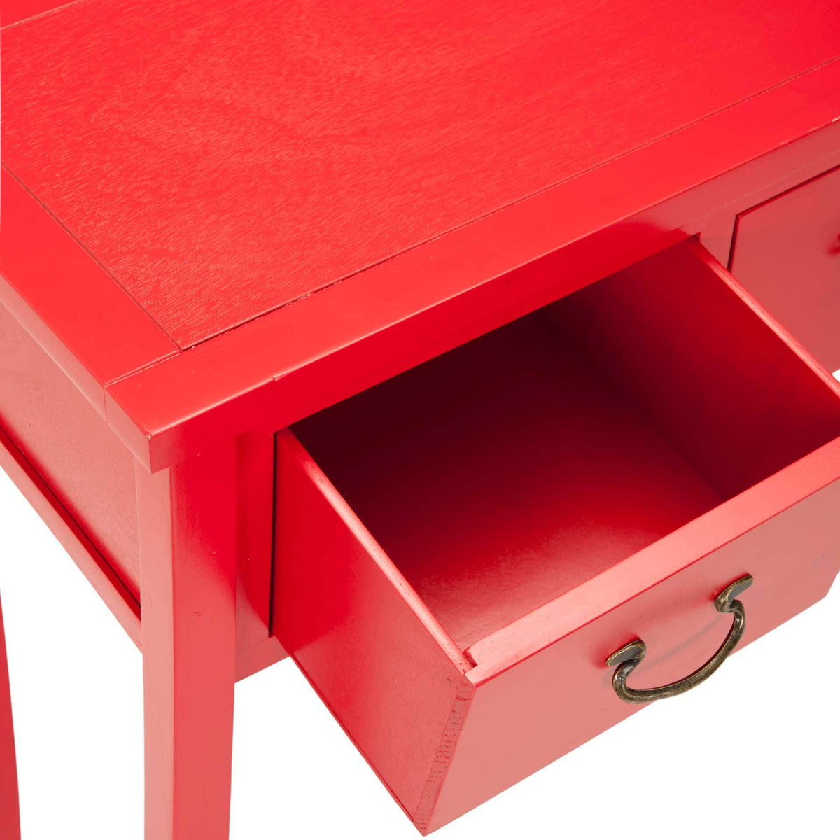 An open red drawer reveals storage beneath a smooth tabletop, with a curved metal pull