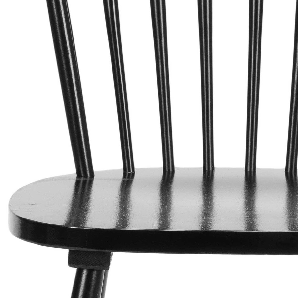 A smooth black seat meets slender spindles in this classic wood dining chair.