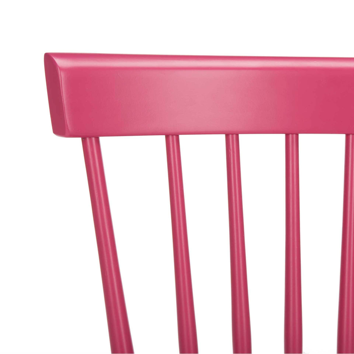 The curved raspberry top rail crowns slim spindles for a playful take on a classic chair.