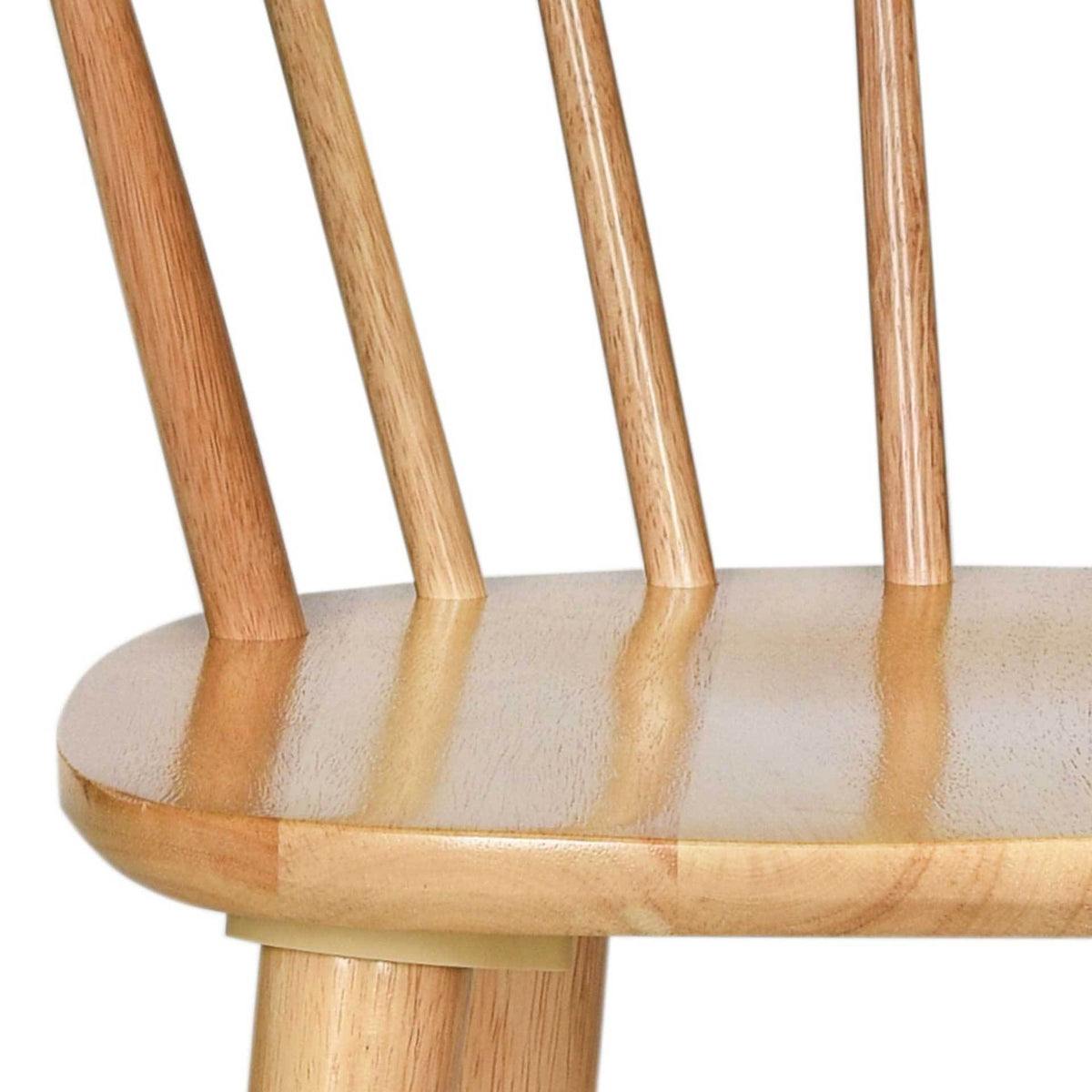 Visible wood grain enriches the seat edge and the spindles rising from it.