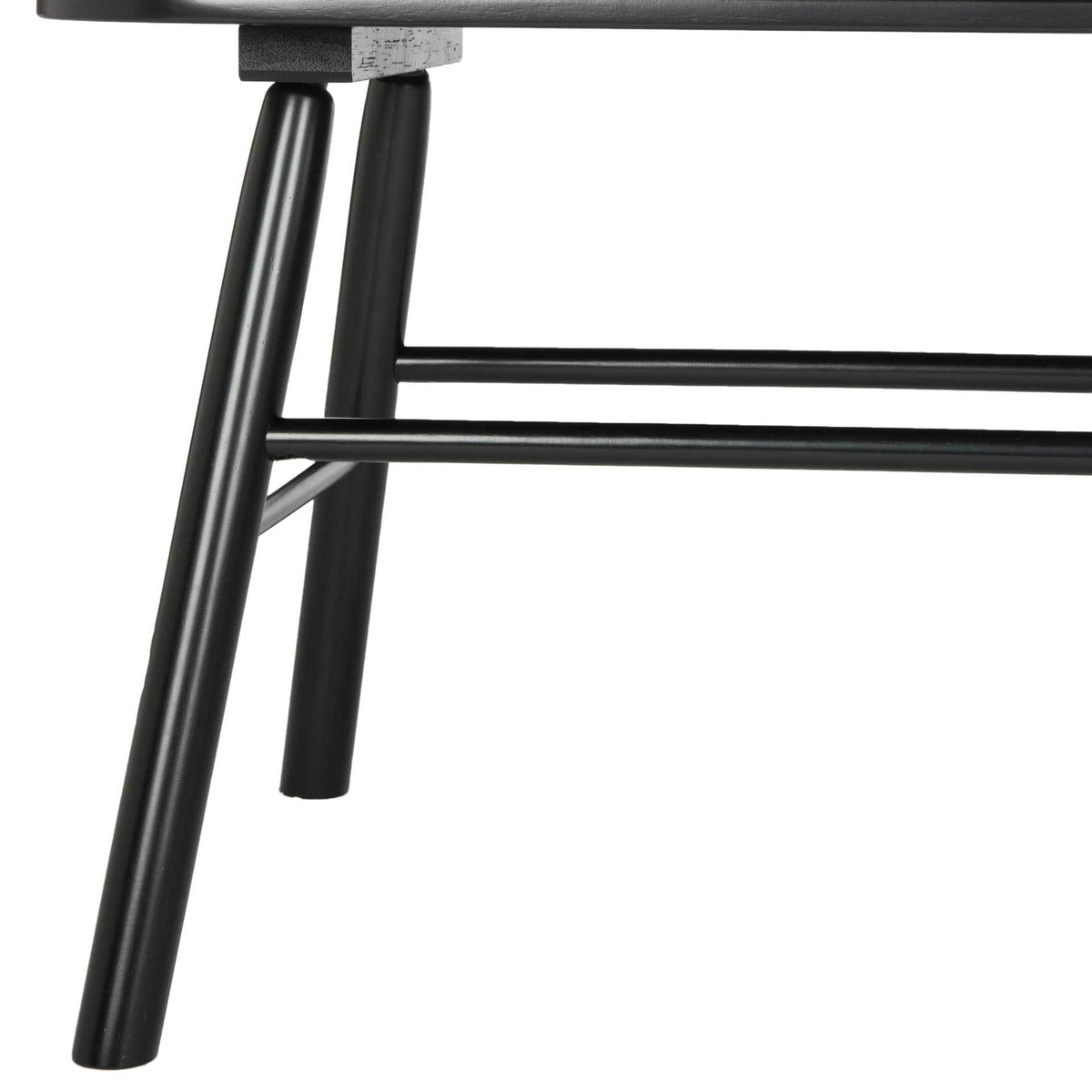 Angled black wood legs and paired stretchers support the streamlined seat.