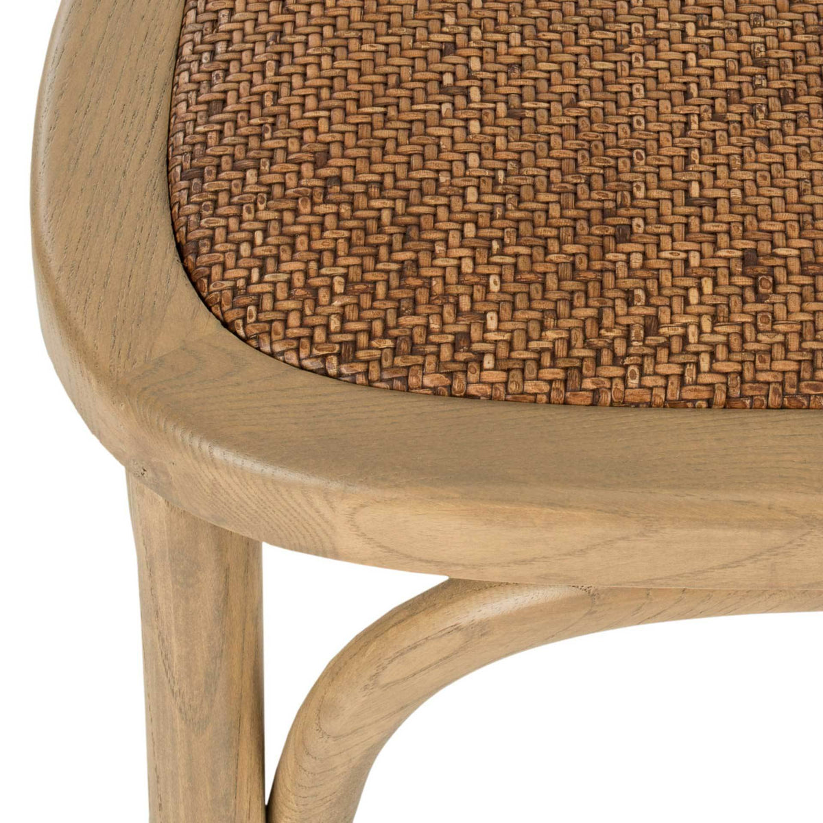 Tightly woven rattan seat meets the warm oak-grain frame and curved underseat brace.