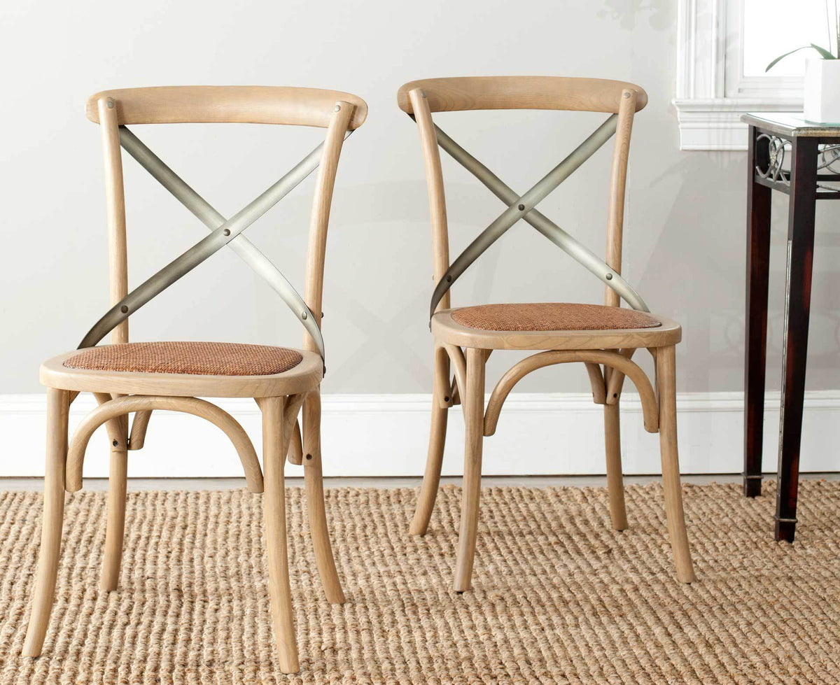 Two warm oak X-back chairs pair woven rattan seats with curved frames for inviting farmhouse style.