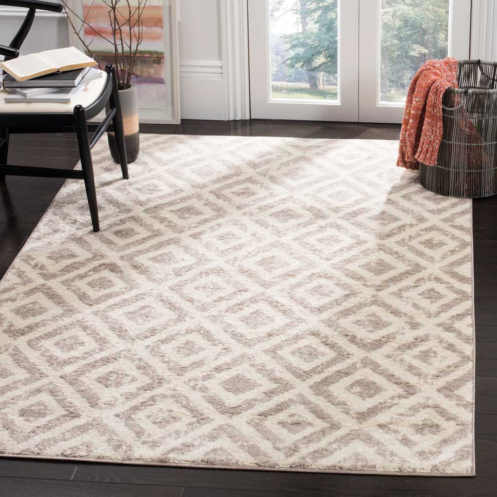 Muted mauve diamonds on an ivory ground add cozy geometric style to a bright living space