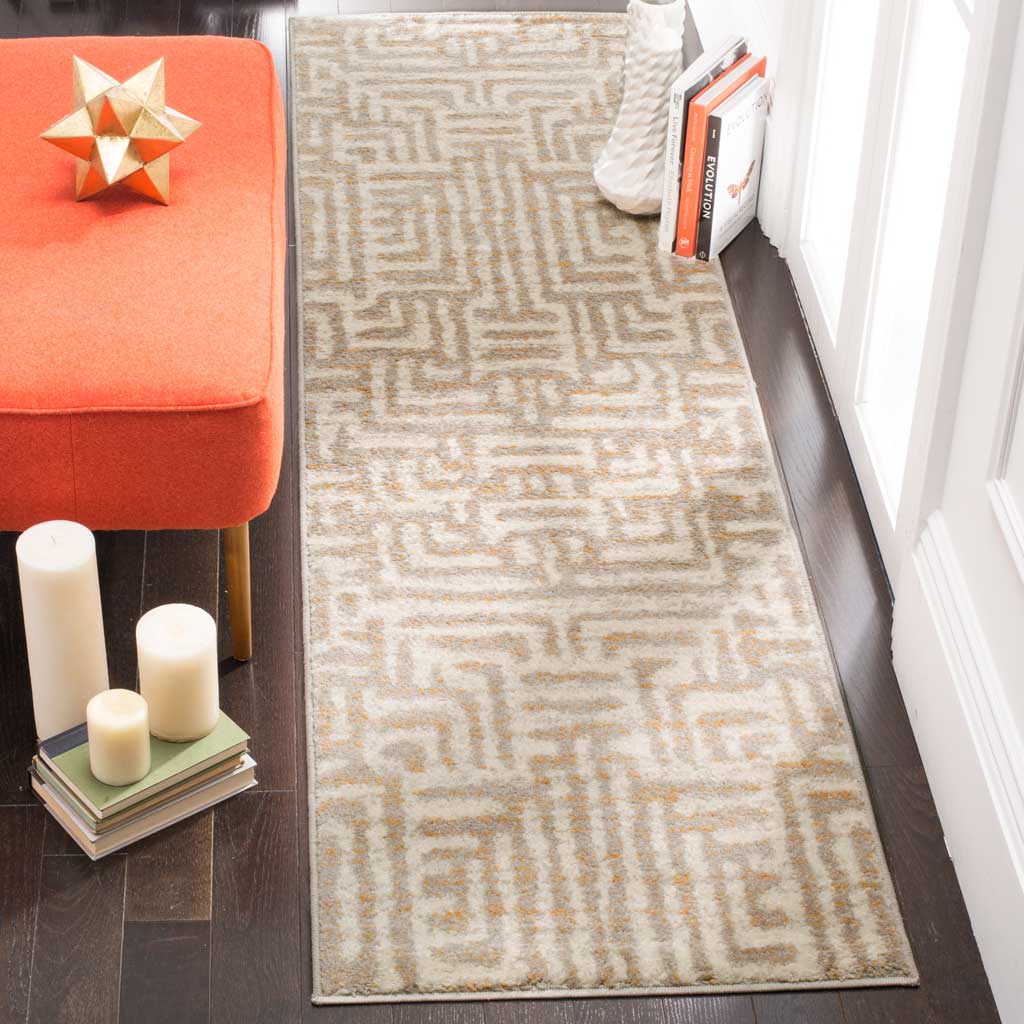 Muted ivory and mauve runner rug softens a narrow space with its geometric design