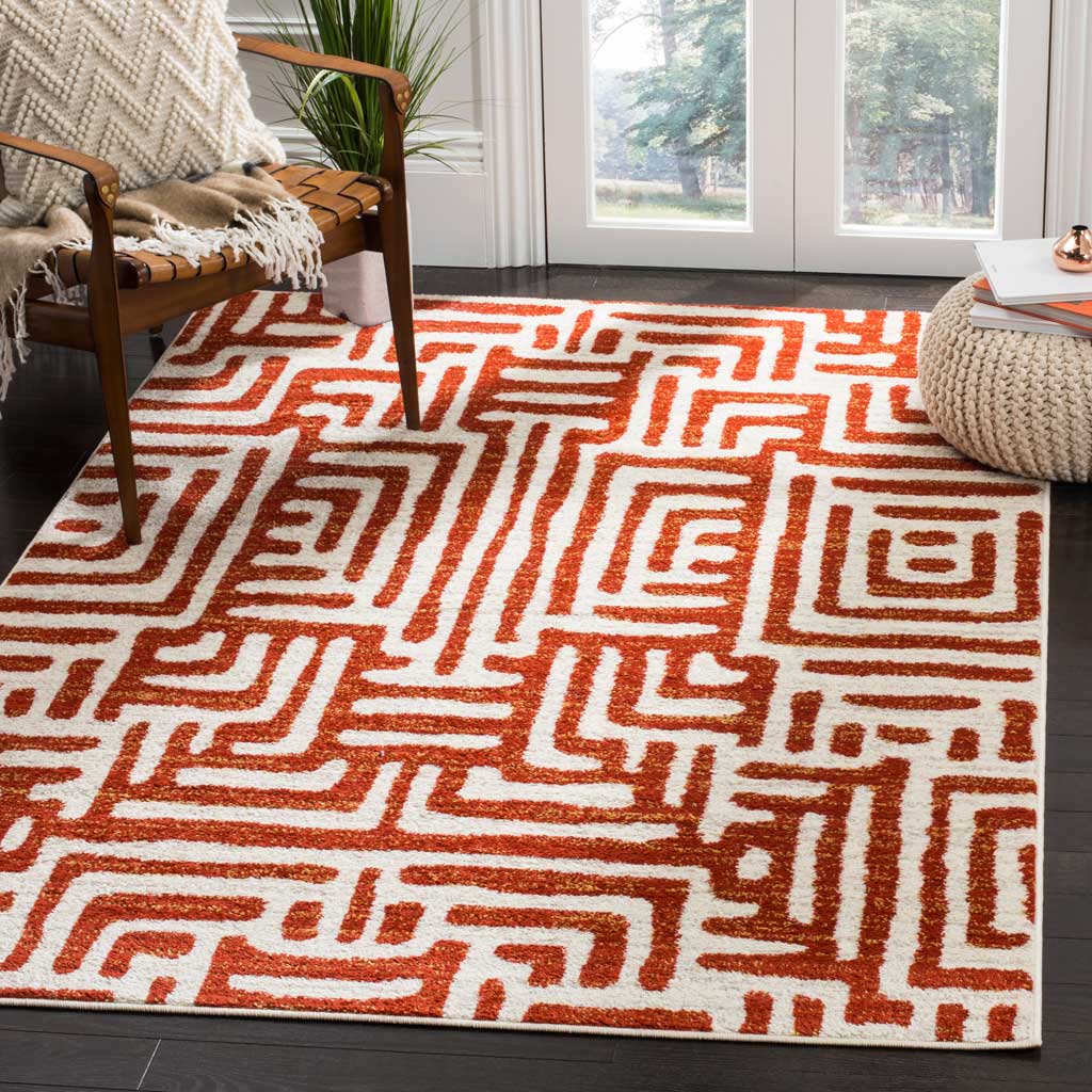 Terracotta geometric lines make this ivory rug a warm focal point in a bright living area.