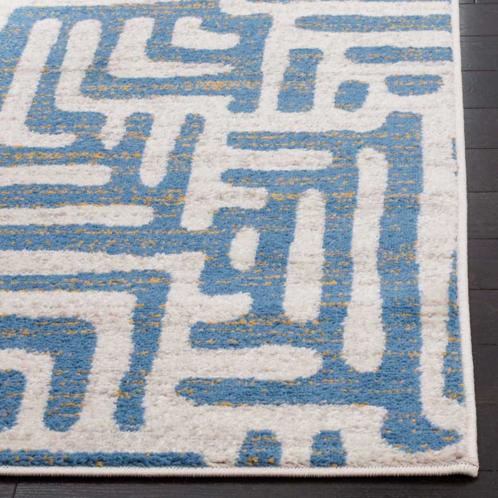 Light blue lines with warm flecks stand out against ivory pile and a neatly bound edge.