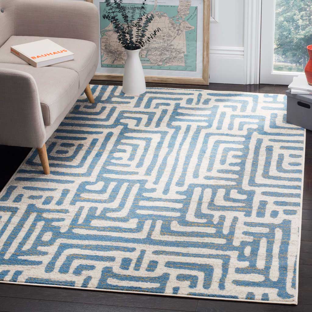 Cool light blue pathways lend a modern accent to an ivory rug in a bright living space.
