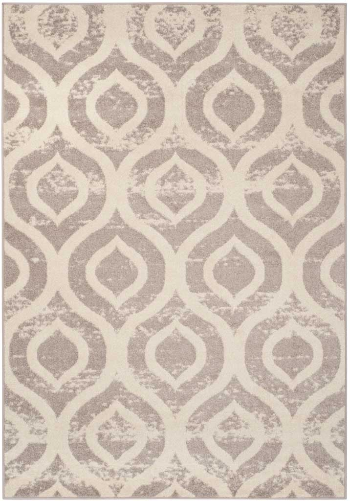 An ivory ground highlights rows of mauve ogee shapes with a gently distressed finish